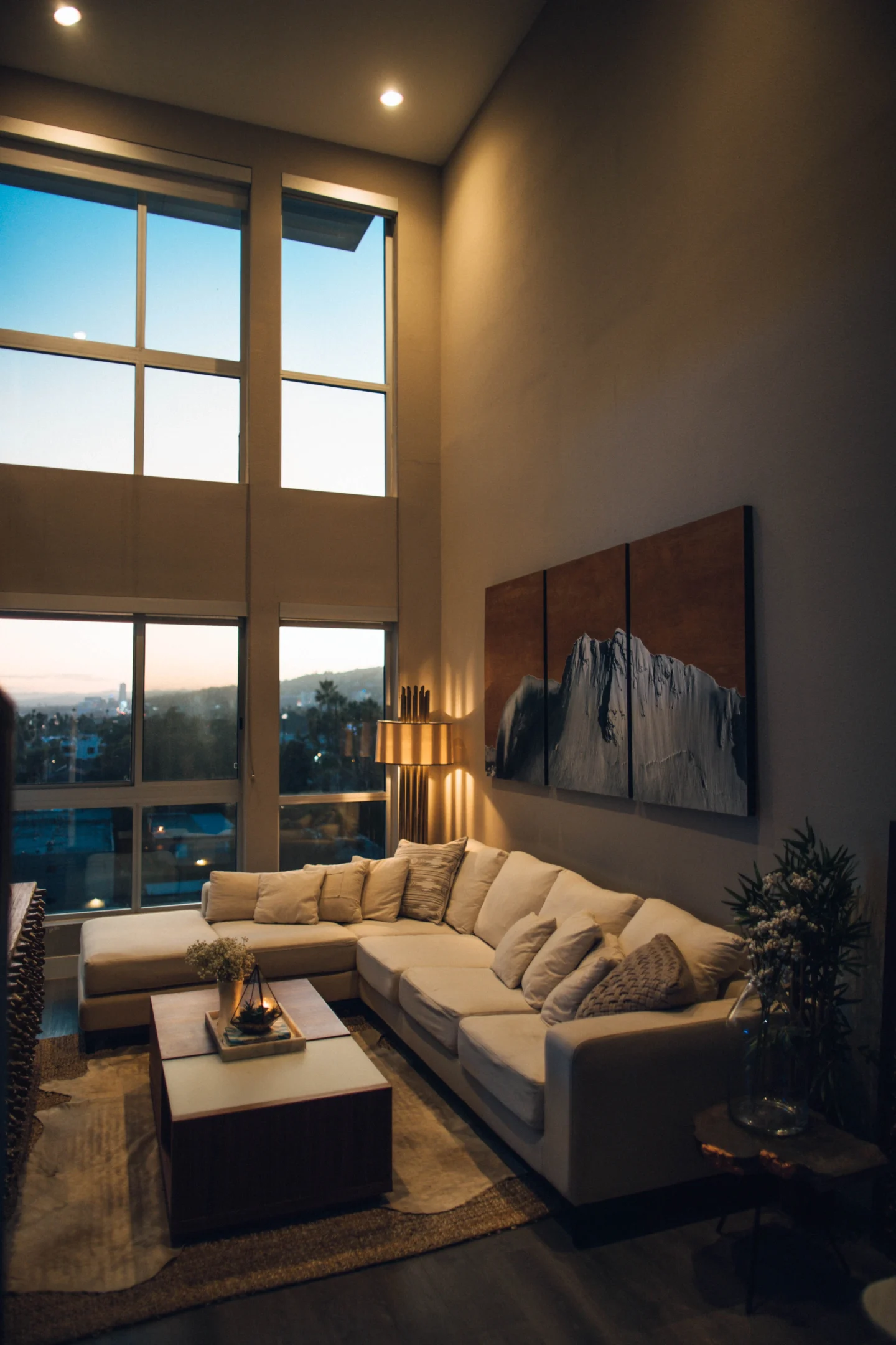 A home with tall windows and a sofa (illustrative)