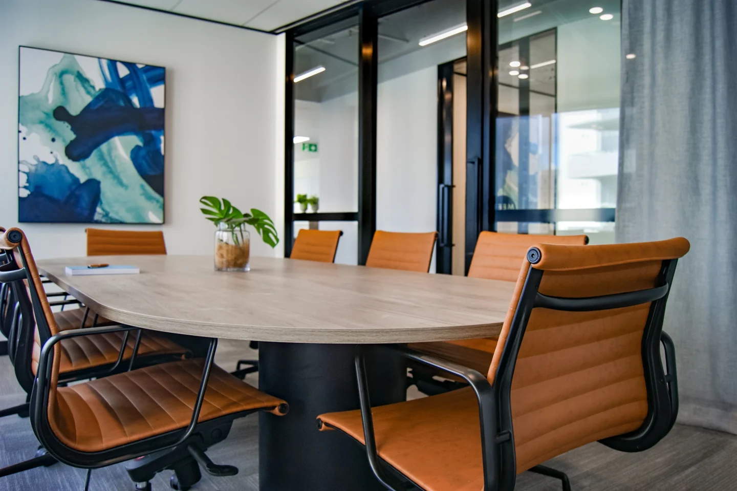 A meeting space with a wooden table (illustrative)