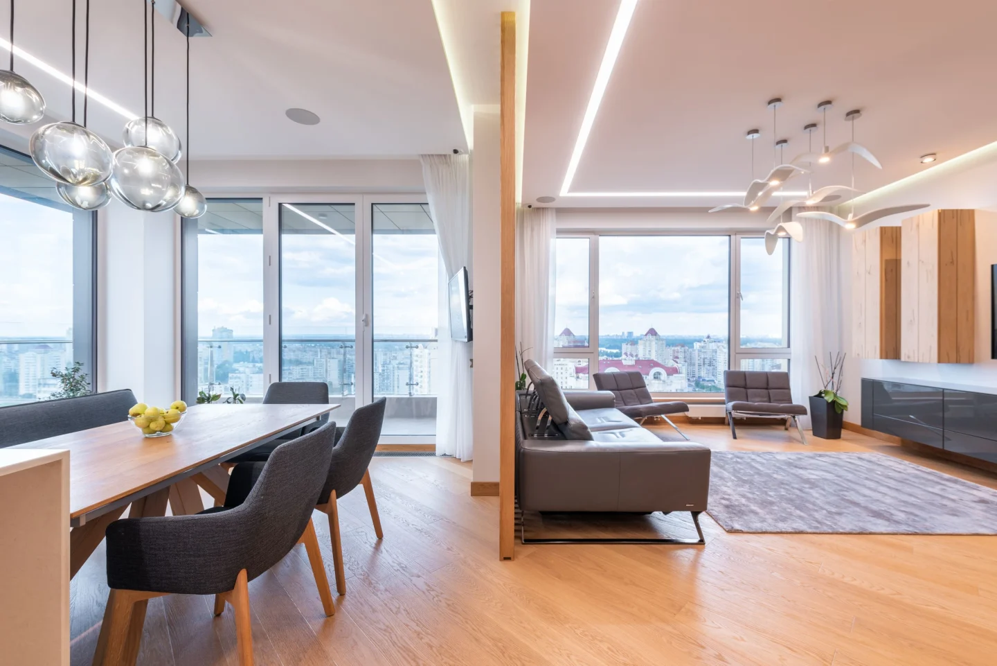 An open dining and living area with large windows (illustrative)